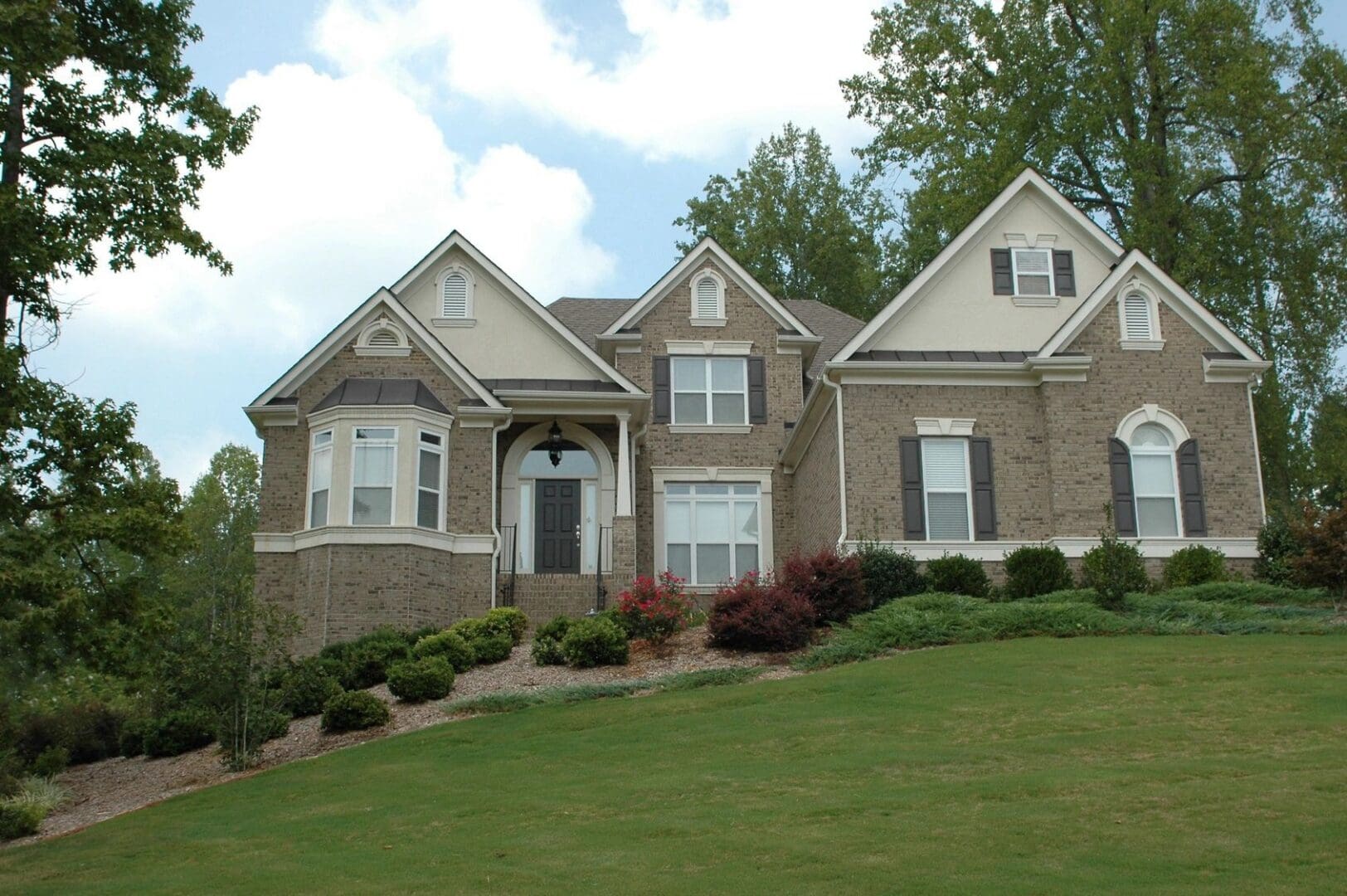 A large house sitting on top of a hill.